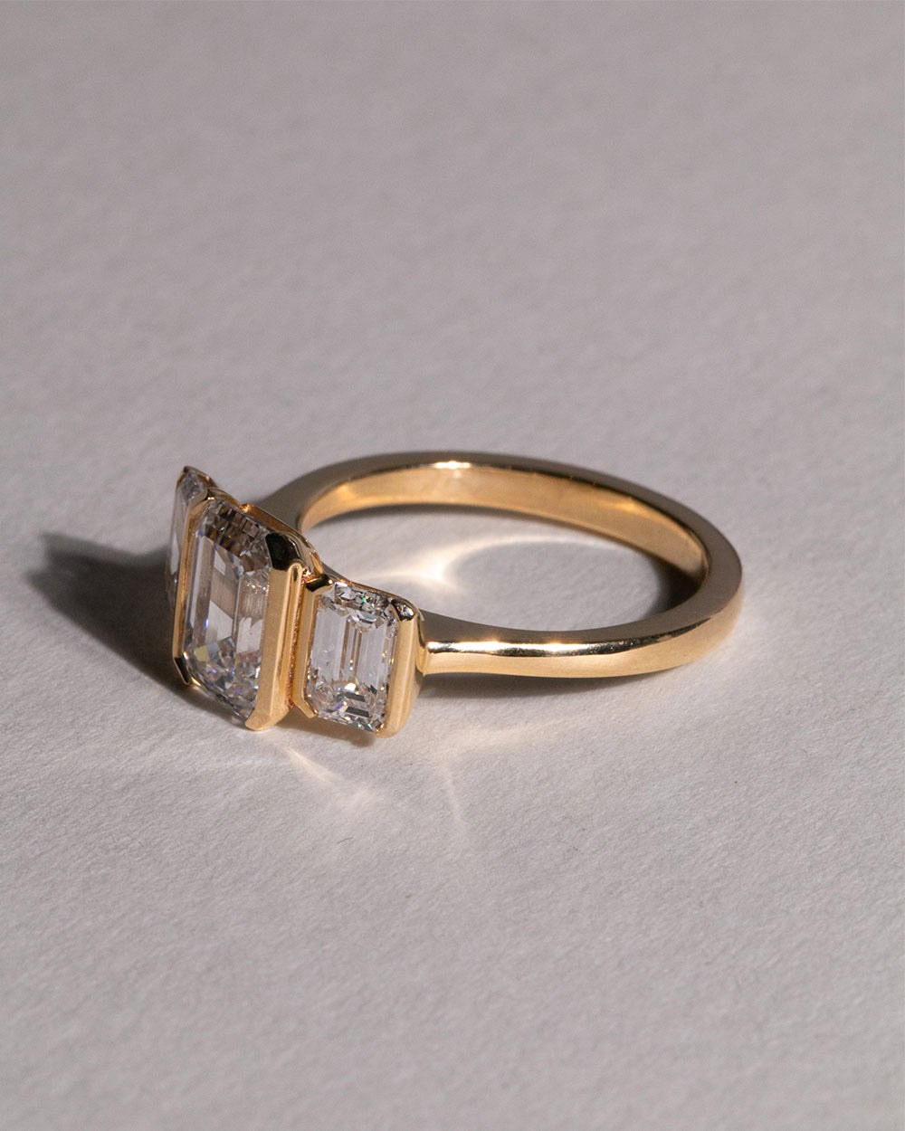 18ct Gold Emerald Cut Lab Grown Diamond Trilogy Ring front side view