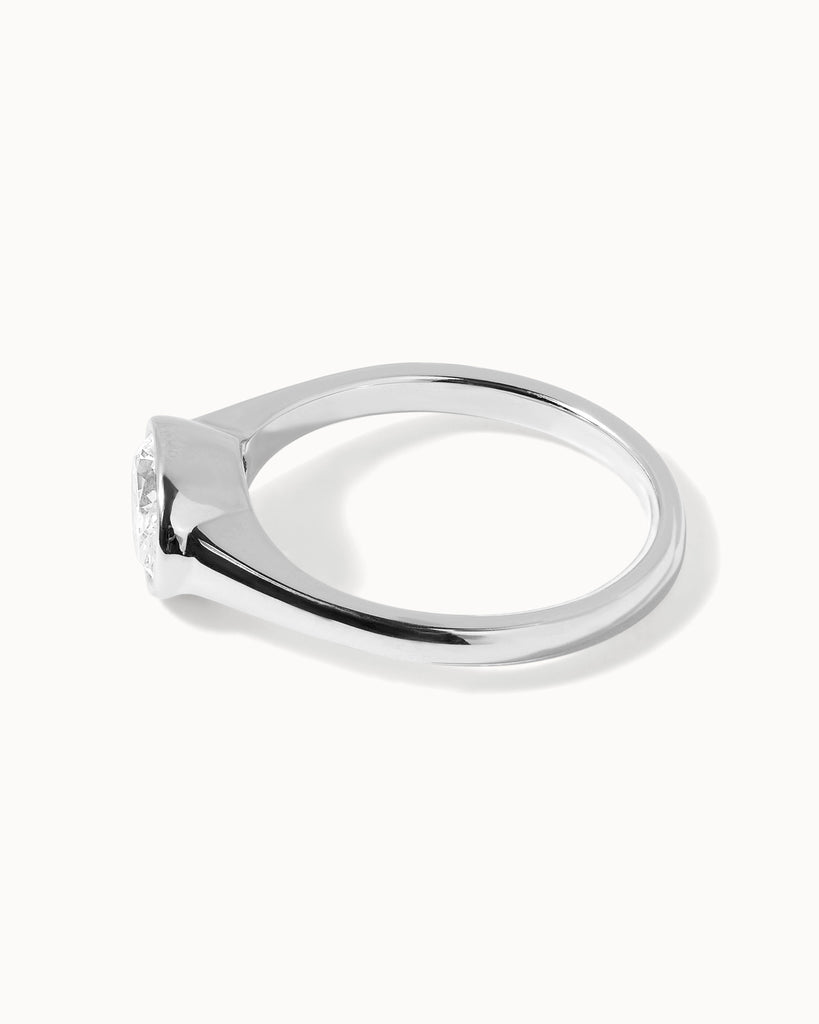 oval cut white diamond in a polished 9ct recycled white gold setting handcrafted in London by Maya Magal