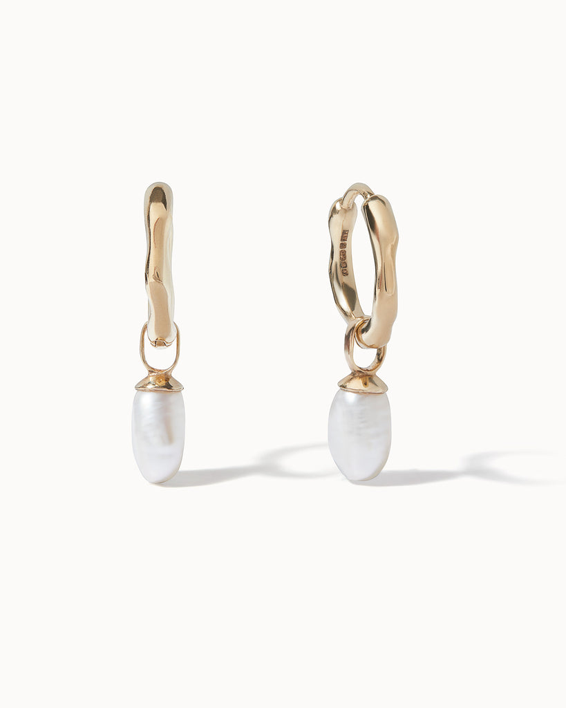 Dainty baroque pearl and organic hoop earrings made by Maya Magal with recycled 9ct solid gold in our London workshop