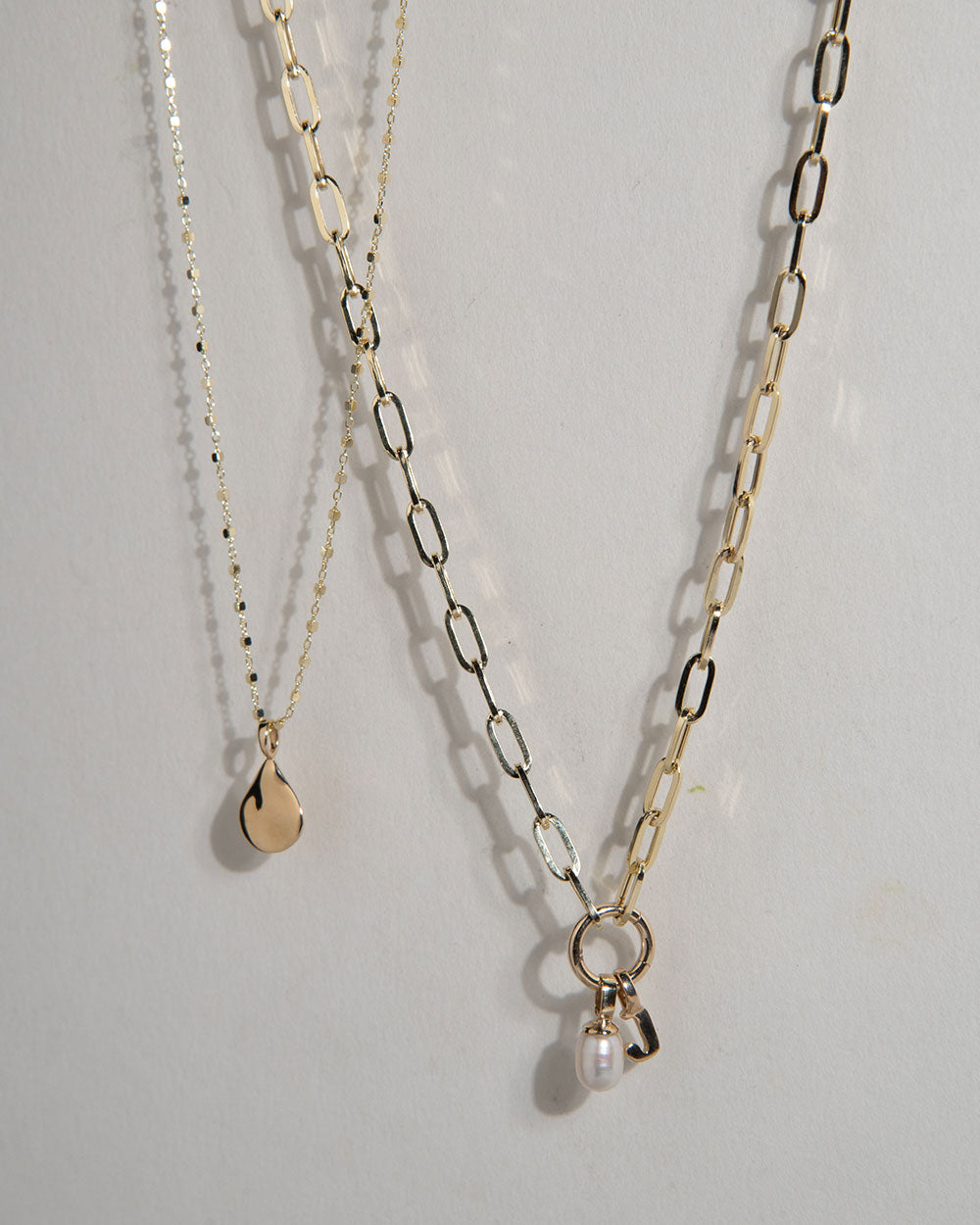 Baroque Pearl Charm displayed on chain with other pendants