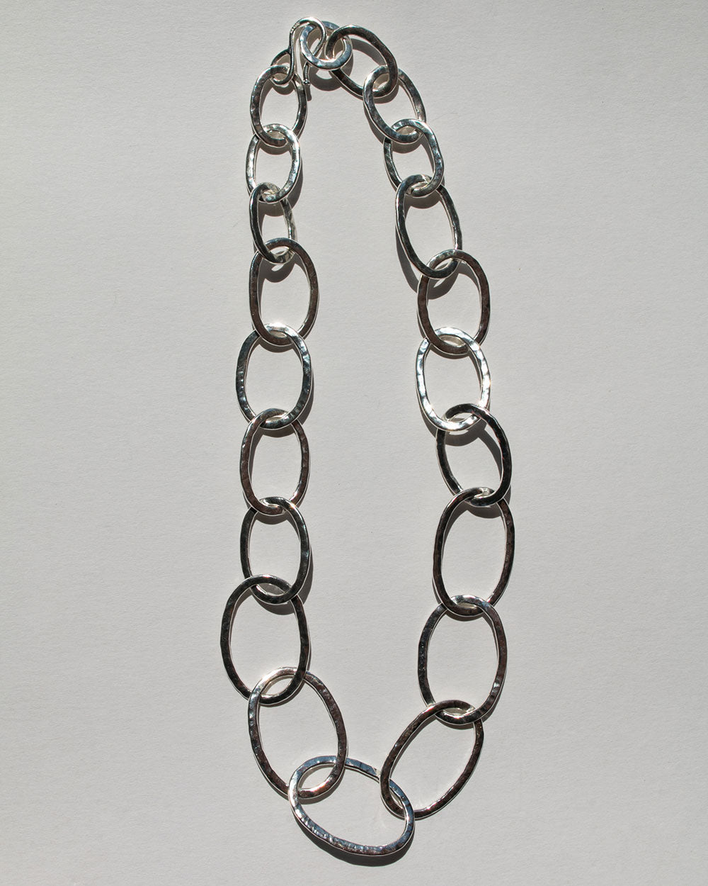 Sterling silver Sculpt Heavy Chain Necklace full photo with clasp on white background.