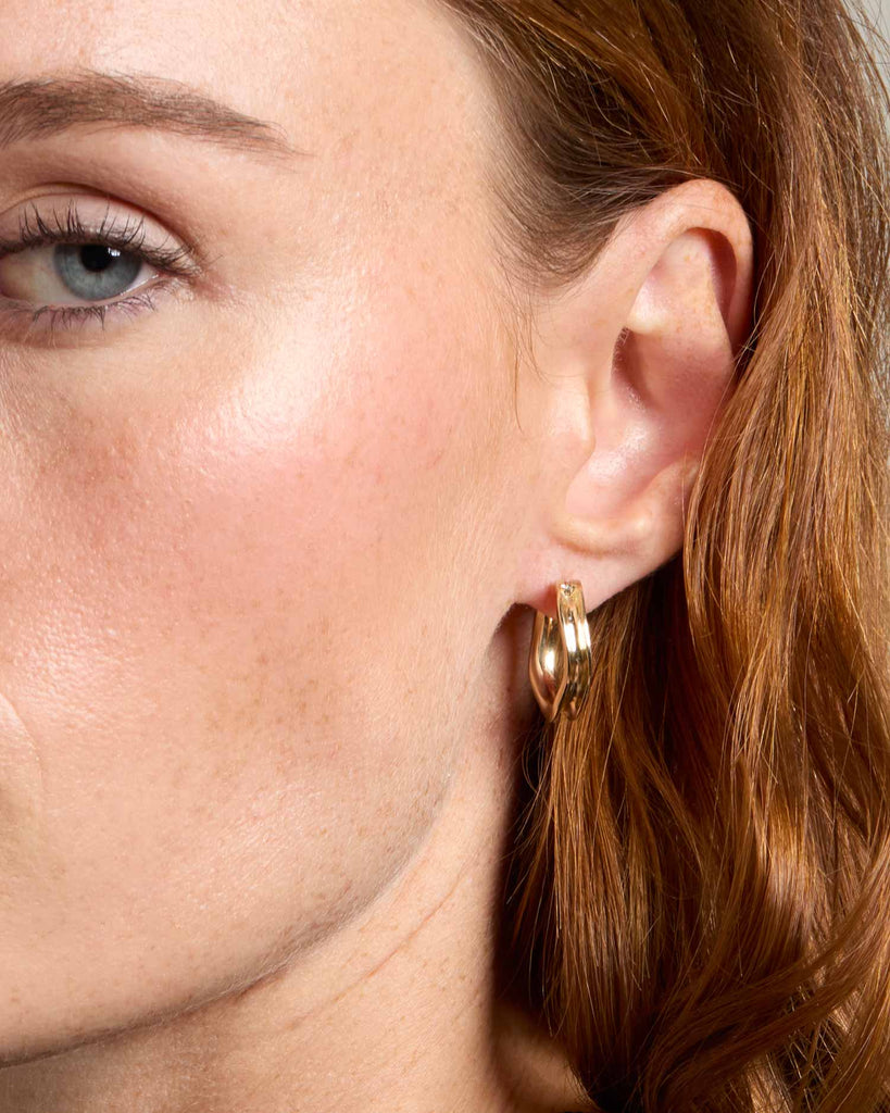Recycled solid gold concave hoop earrings handcrafted in London by Maya Magal London