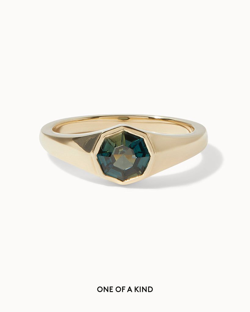 Solid gold engagement ring featuring an octagonal sapphire in bezel setting by Maya Magal London