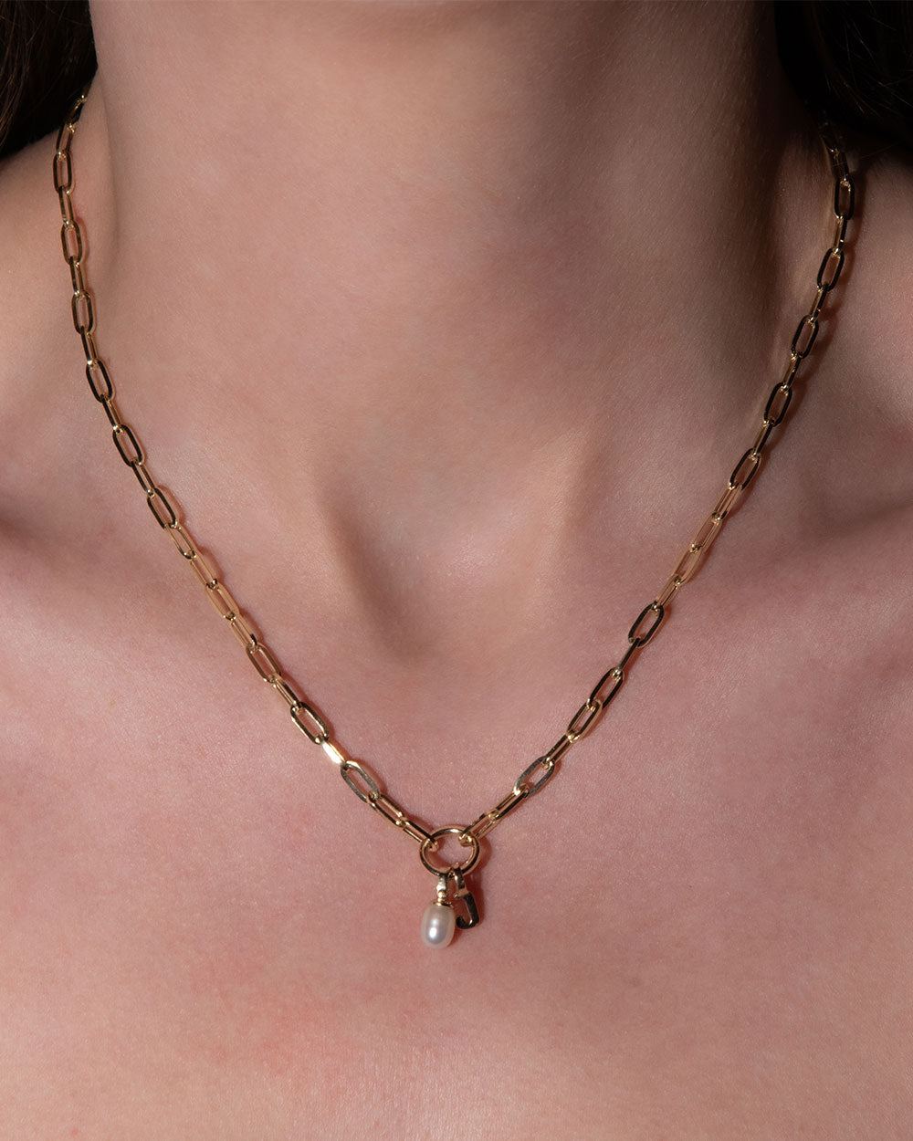 Baroque Pearl Charm displayed on model with a chain