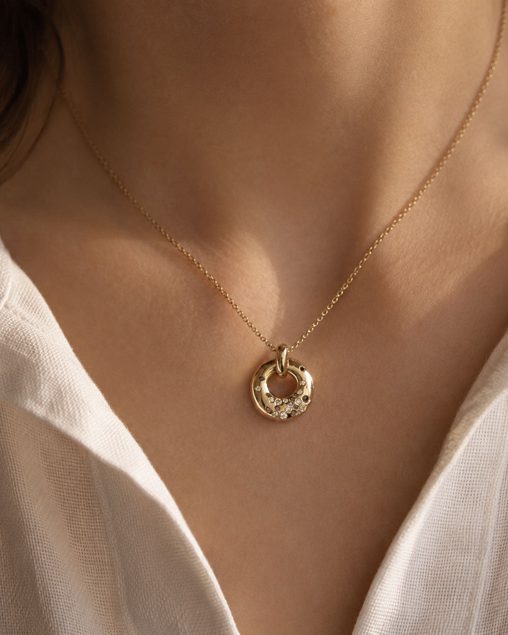 Recycled 9ct solid yellow gold charm necklace with finely set white and champagne natural diamonds handcrafted in London by Maya Magal London