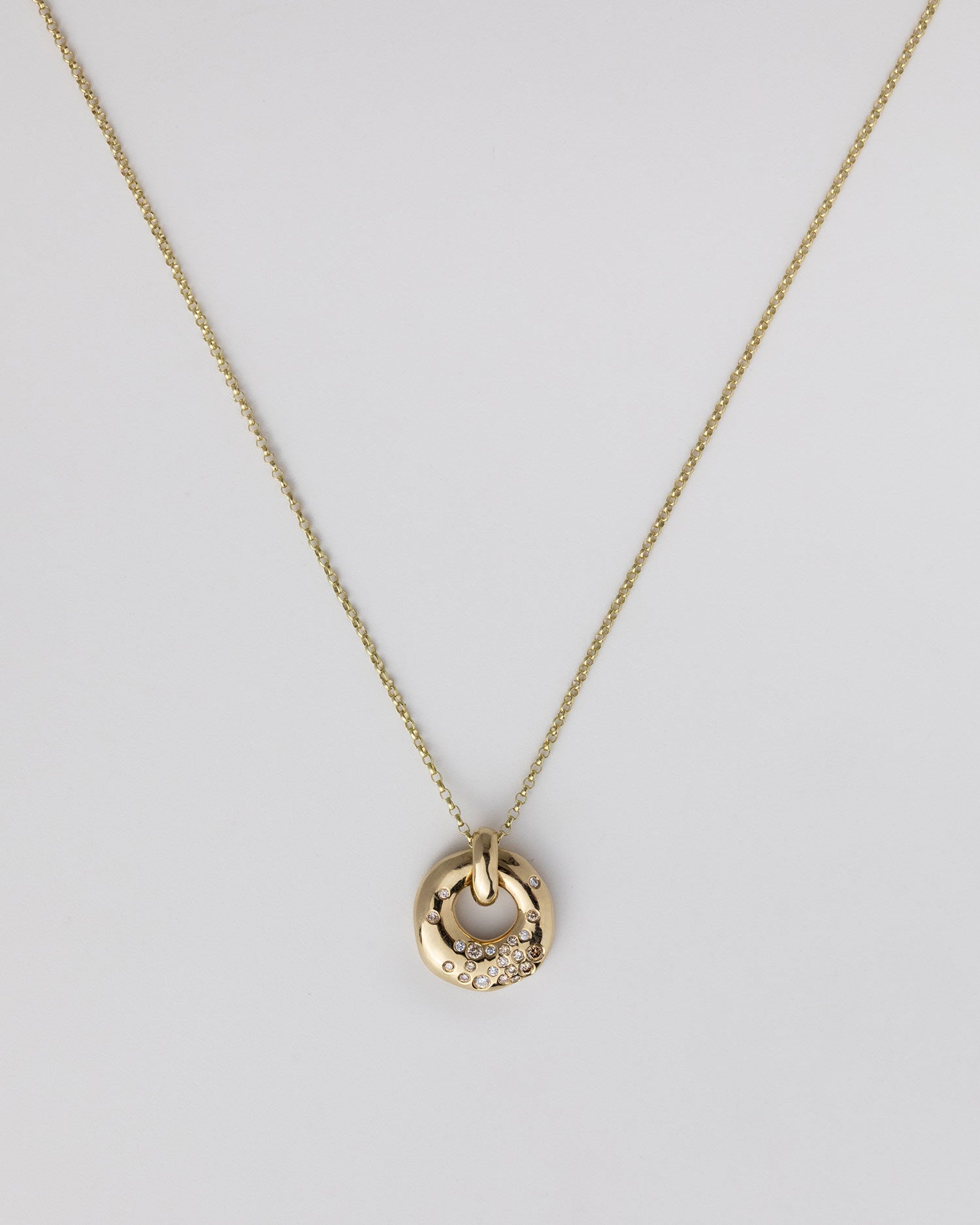 Recycled 9ct solid yellow gold charm necklace with finely set white and champagne natural diamonds handcrafted in London by Maya Magal London