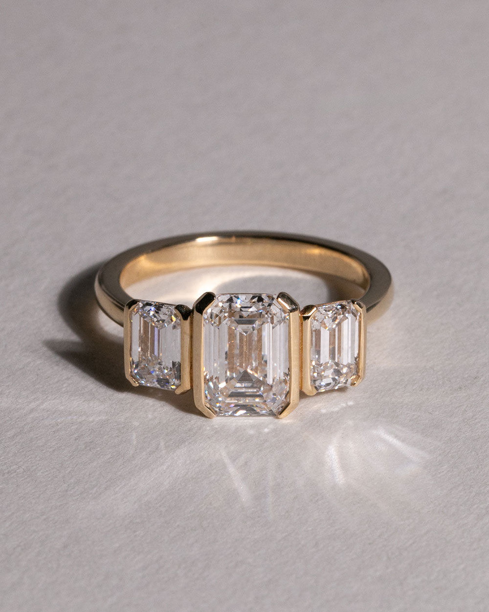 Front view of 9ct Gold 2.05ct Emerald Cut Lab Grown Diamond Trilogy Ring.
