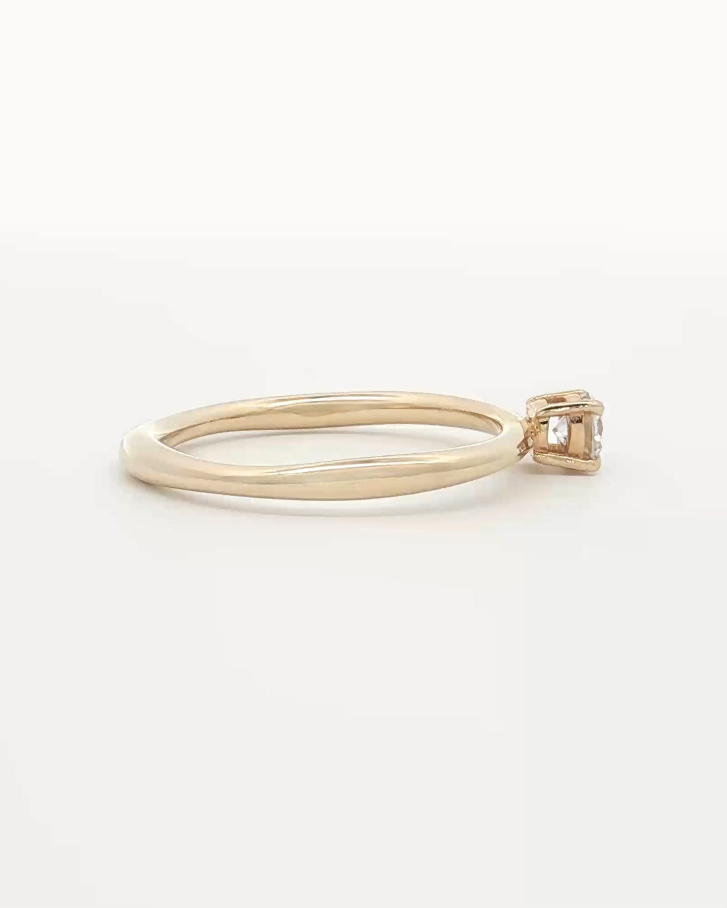 side view photo of 0.25ct Lab Grown Diamond Organic Ring with 9 Ct solid gold band on white backdrop