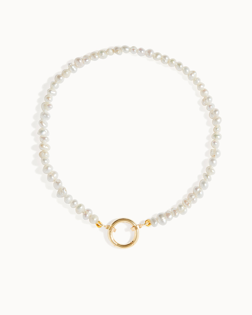 Solid gold Milos pearl beaded charm bracelet with freshwater pearls by Maya Magal London