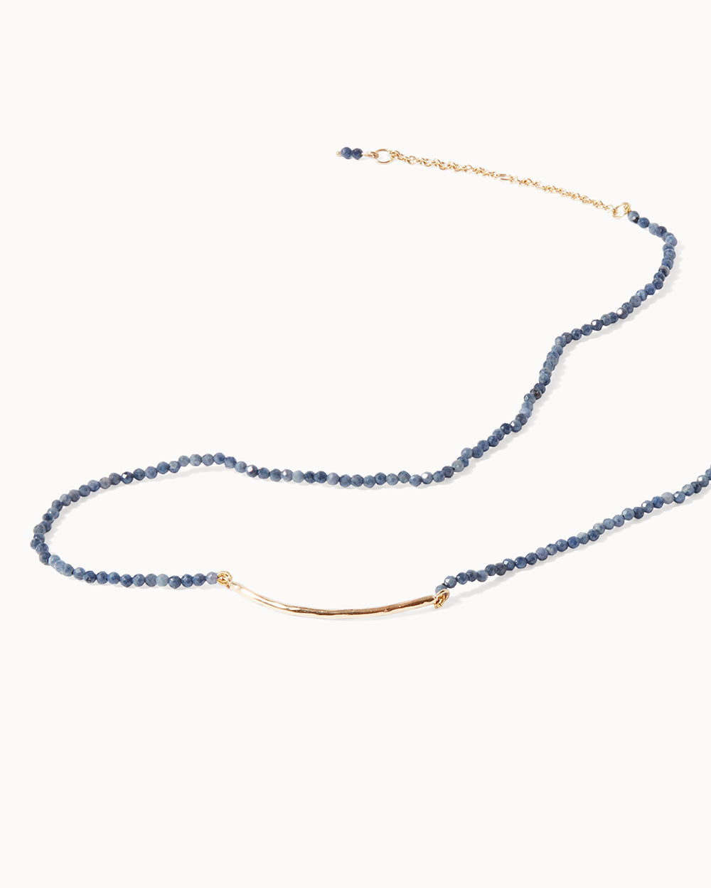 Elegant sapphire gemstone necklace featuring solid gold bar and clasp by Maya Magal London