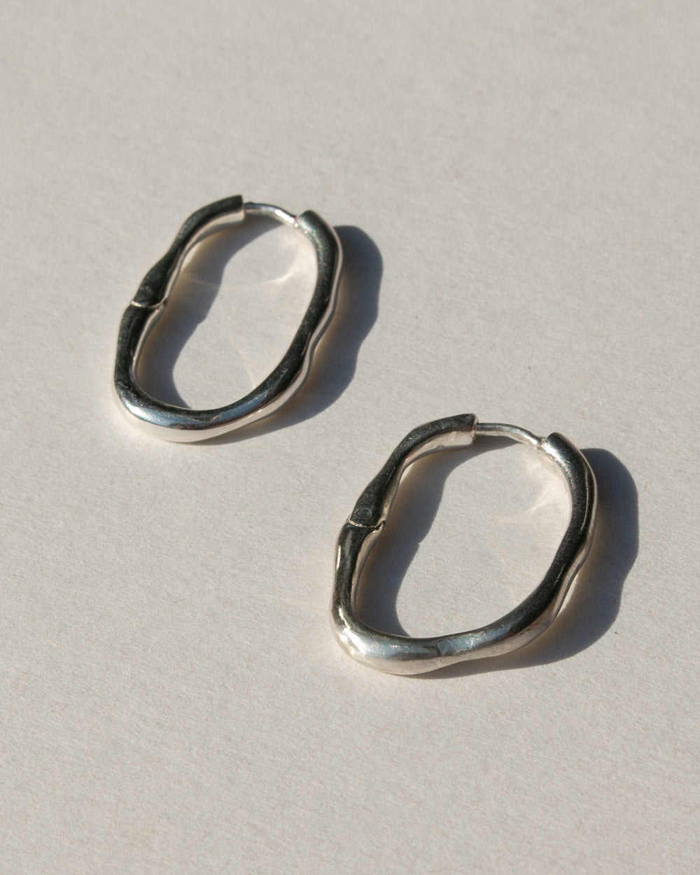 925 sterling silver organic bold hoops side view.