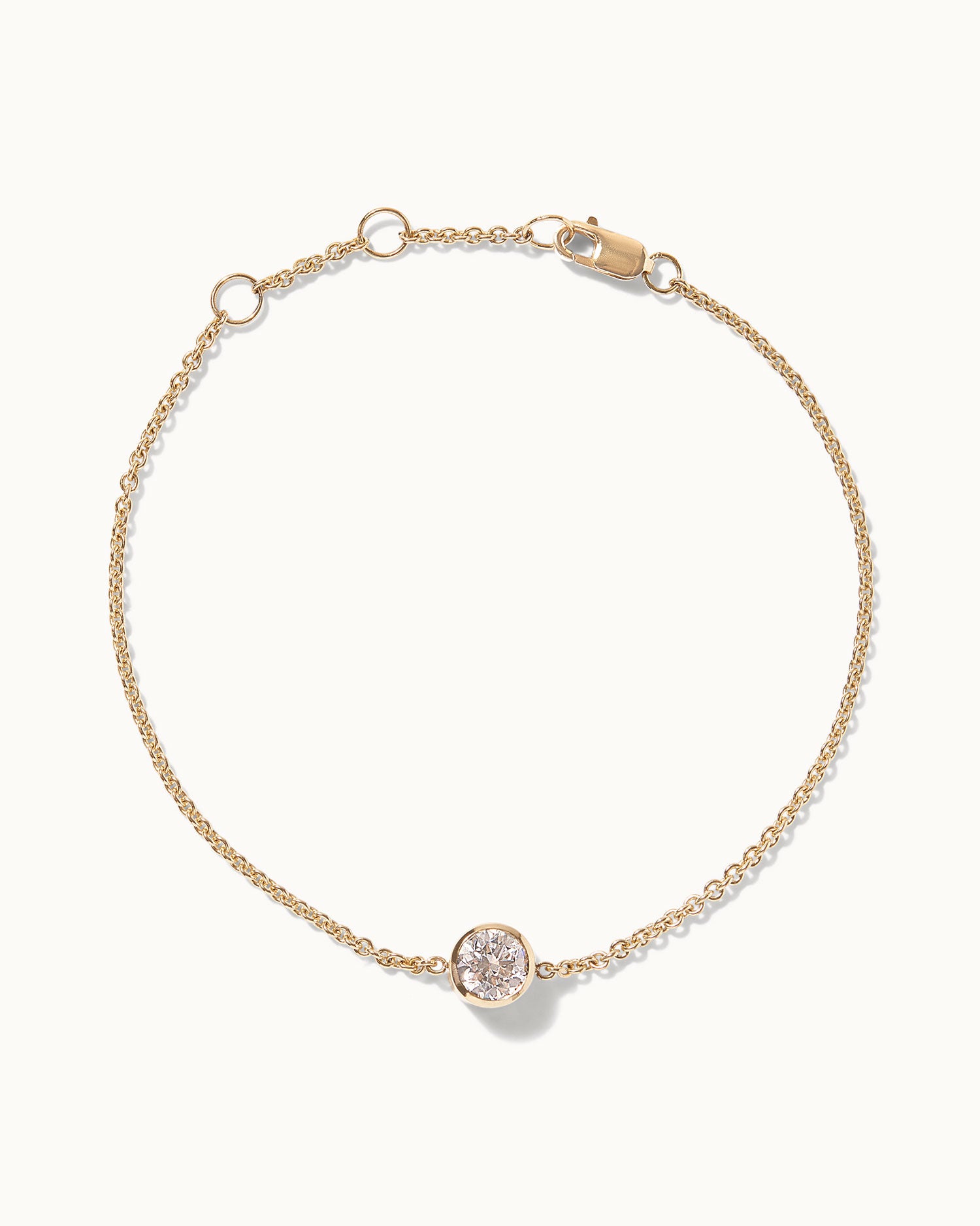 9ct Solid recycled gold necklace with .8ct white diamond bracelet made in london displayed on white background.