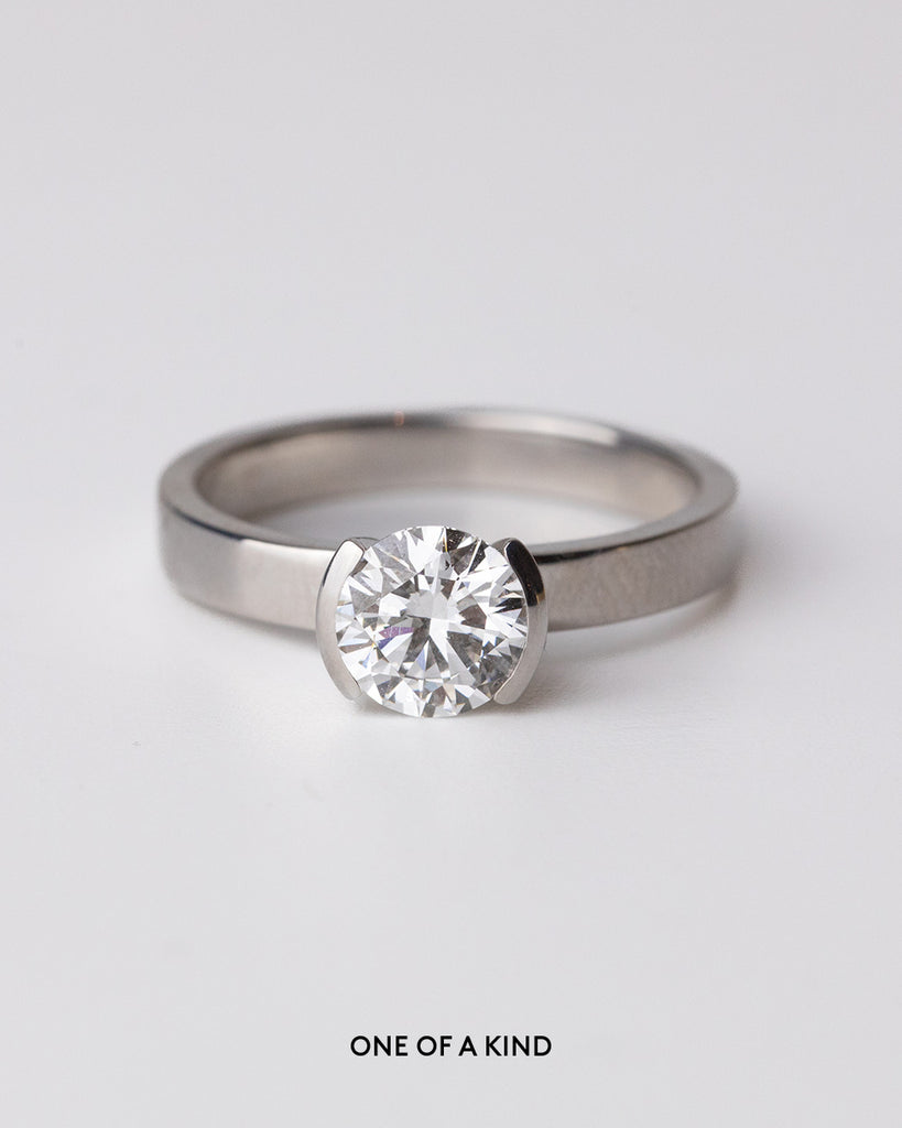 Round cut lab grown diamond solitaire ring set in a recycled 9 ct solid white gold band handcrafted in London by Maya Magal
