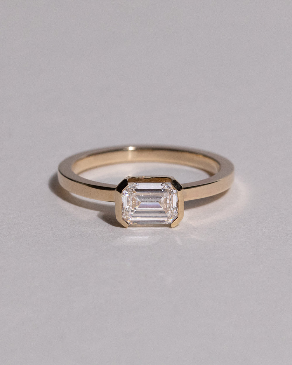 Front view of 9ct Gold Emerald Cut 1ct Lab Grown Diamond Ring on white background.