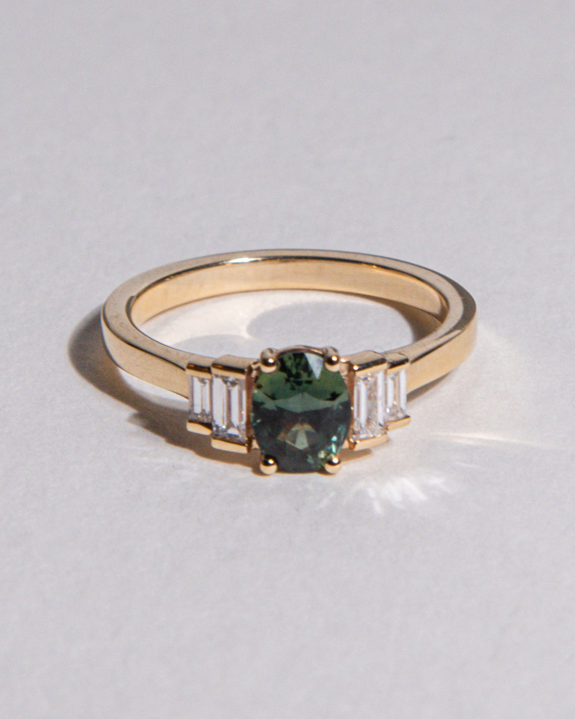 front view photo of 9 Ct solid gold Nina 1.22ct Green Sapphire Ring on white background