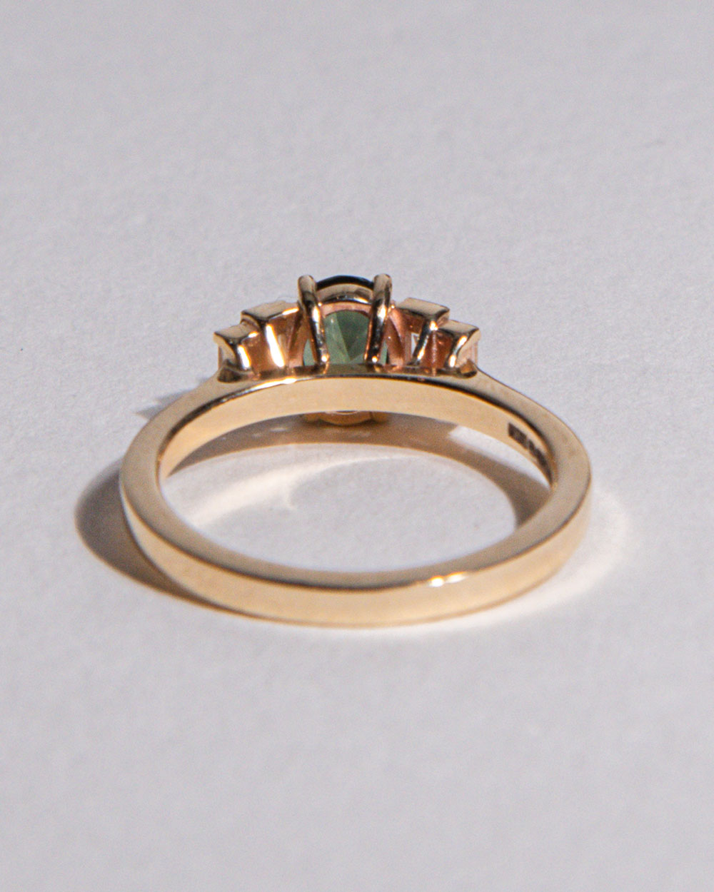 back view photo of 9 Ct solid gold Nina 1.22ct Green Sapphire Ring on white background