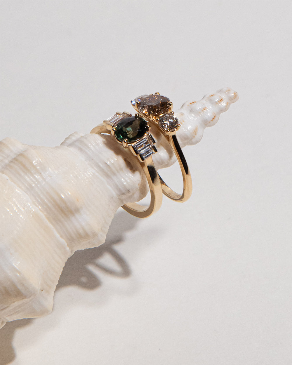 18Ct solid gold Noor 1.02ct Champagne Diamond Ring displayed with another ring on white background