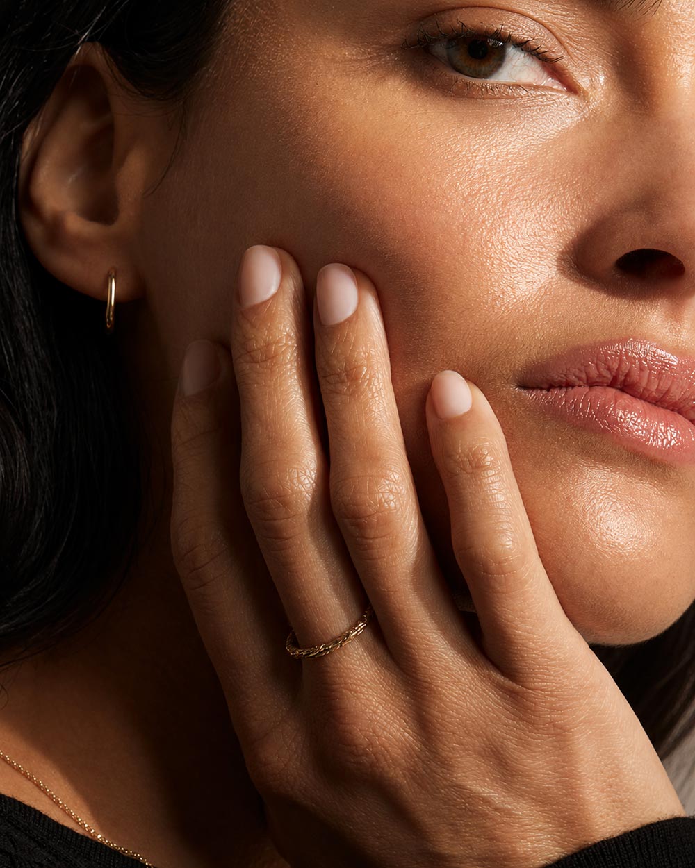 Model wearing Solid gold hoop earrings