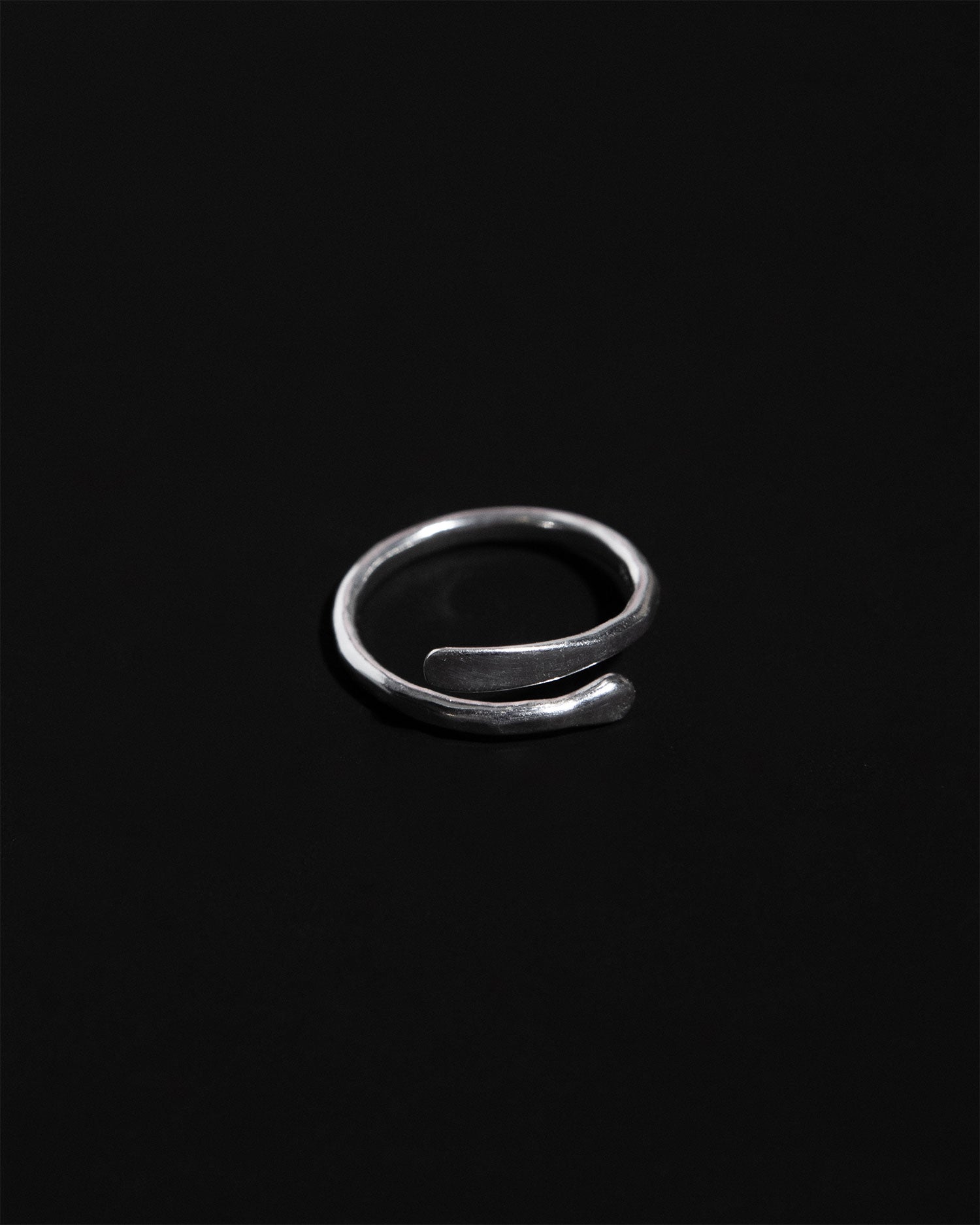 Sculptural adjustable ring in sterling silver with hammered finish handcrafted in London by Maya Magal London