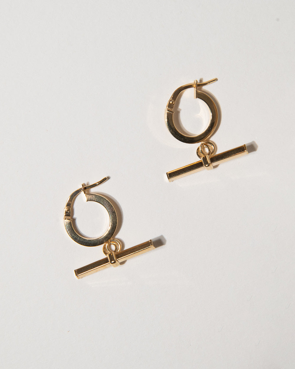 9 ct gold T-Bar Charm Hoop Earrings on white background side view