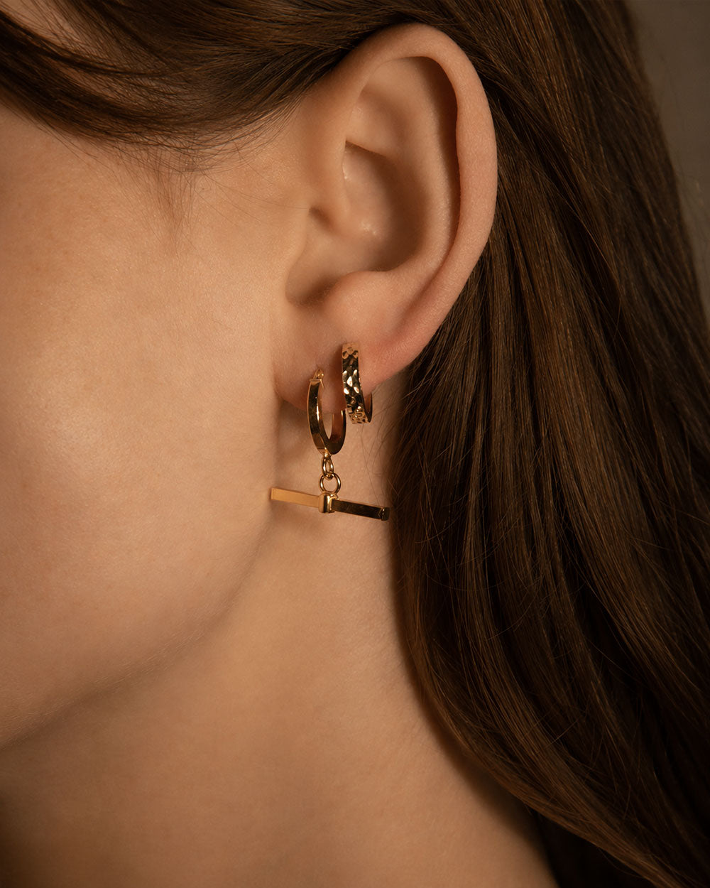 9 ct gold T-Bar Charm Hoop Earrings on model. Recycled solid gold sustainable materials.
