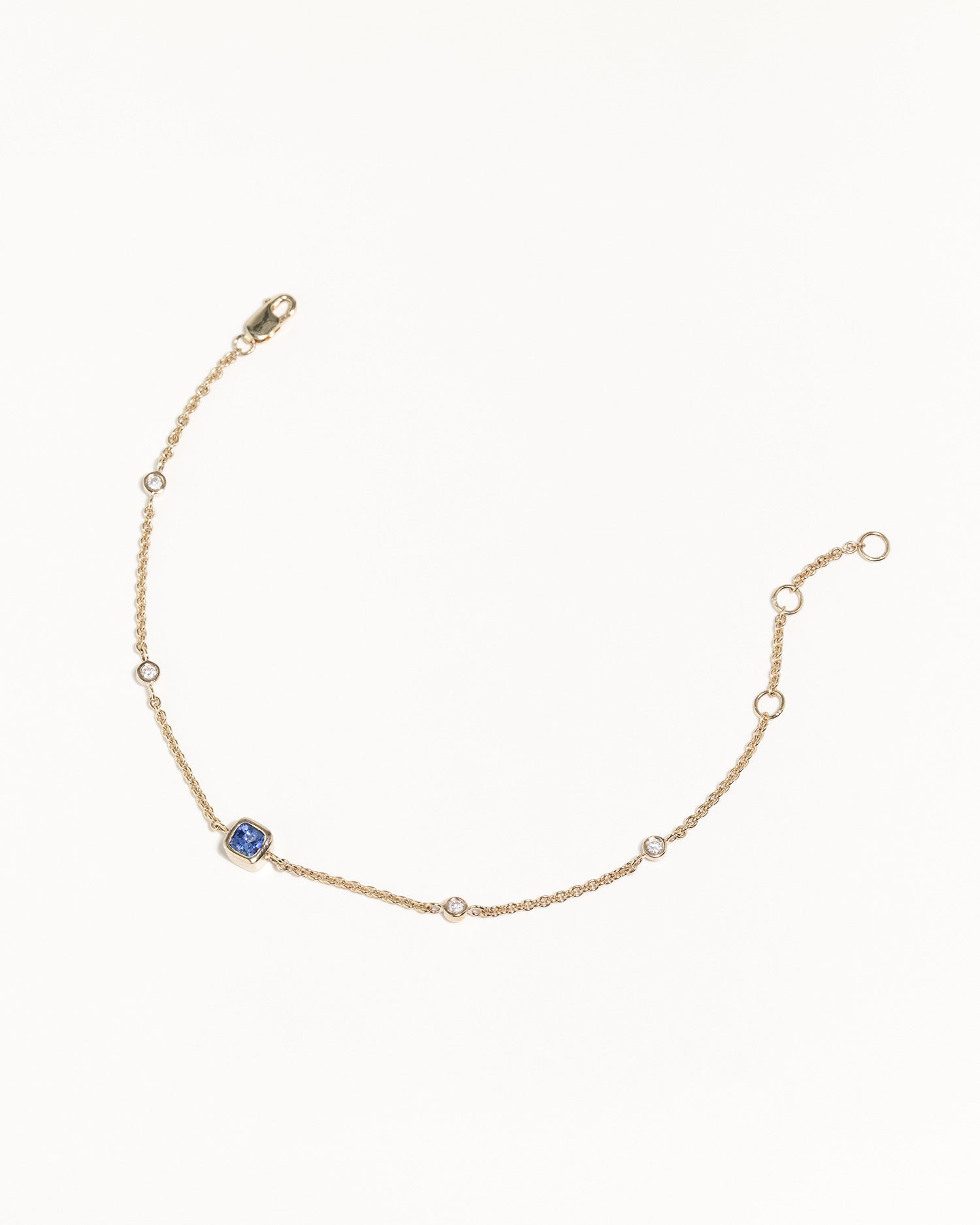 recycled 9ct solid gold bracelet with lab grown diamonds and cushion cut sapphire handcrafted in London by Maya Magal London