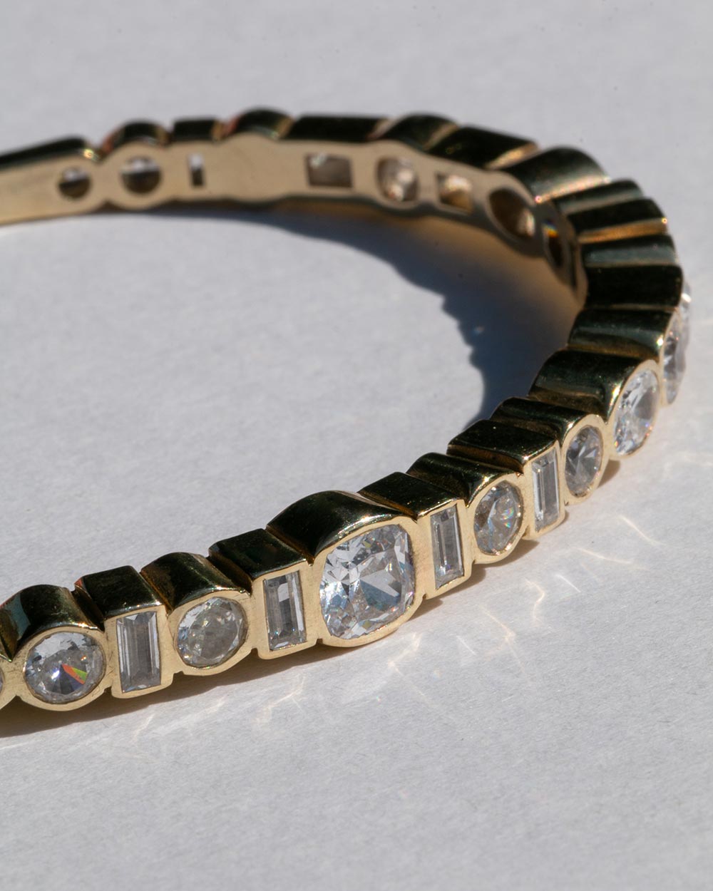Close up of gold Vega Diamond Bangle.