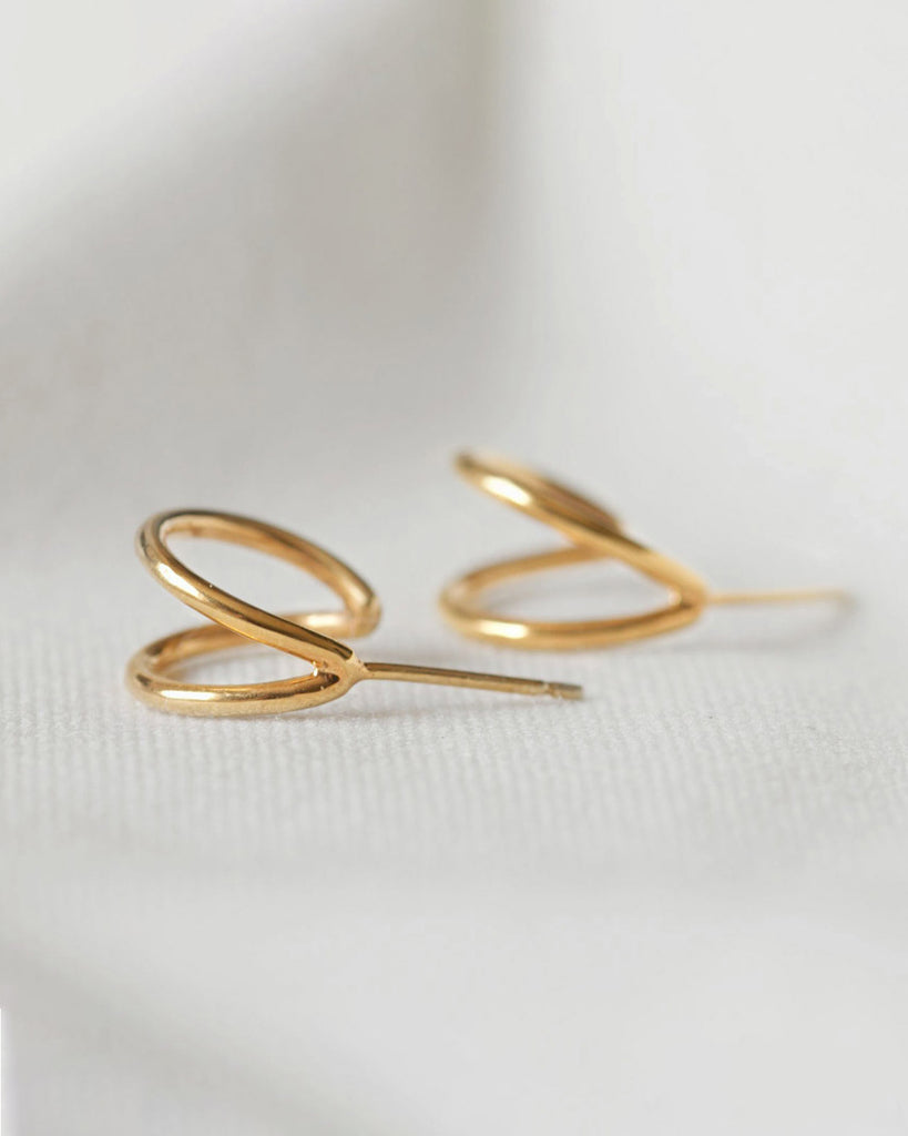 Recycled 925 sterling silver plated in 18ct gold huggie hoop earrings handcrafted in London by Maya Magal London