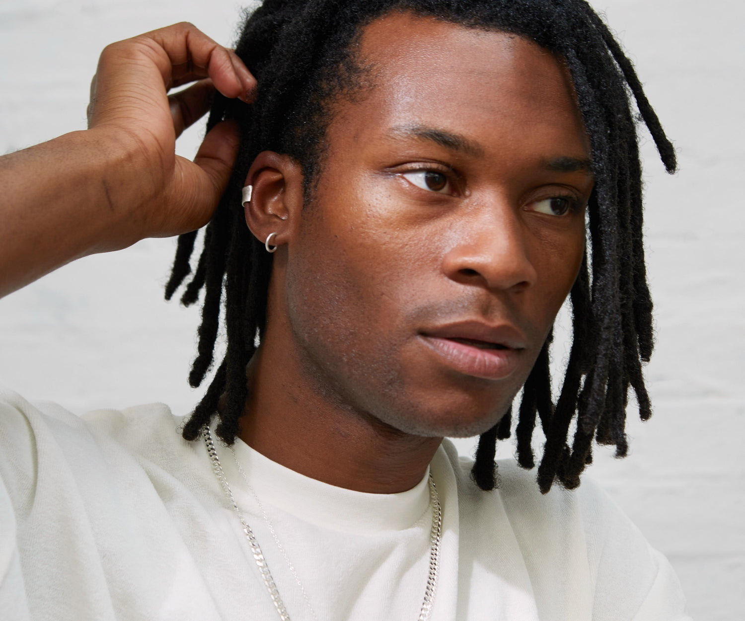 man wearing the Maya Magal sterling silver single hoop