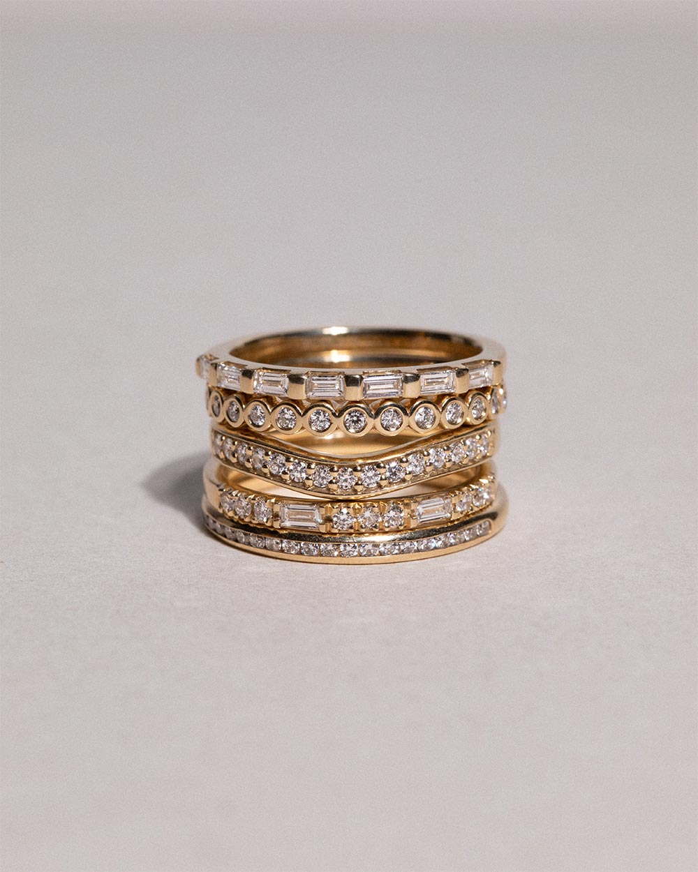 18ct Yellow Gold Dual Cut Diamond Ring displayed on white background with 4 other rings