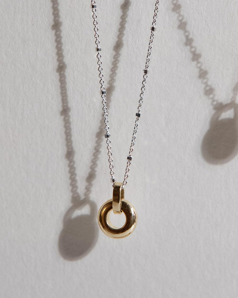 Recycled 925 sterling silver chain with 9ct solid gold open circle charm handmade in London by Maya Magal London