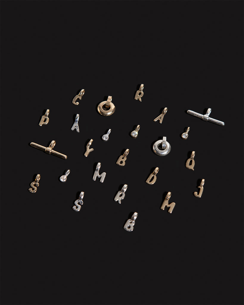 Recycled 925 sterling silver and 9ct solid gold charms handmade in London by Maya Magal London