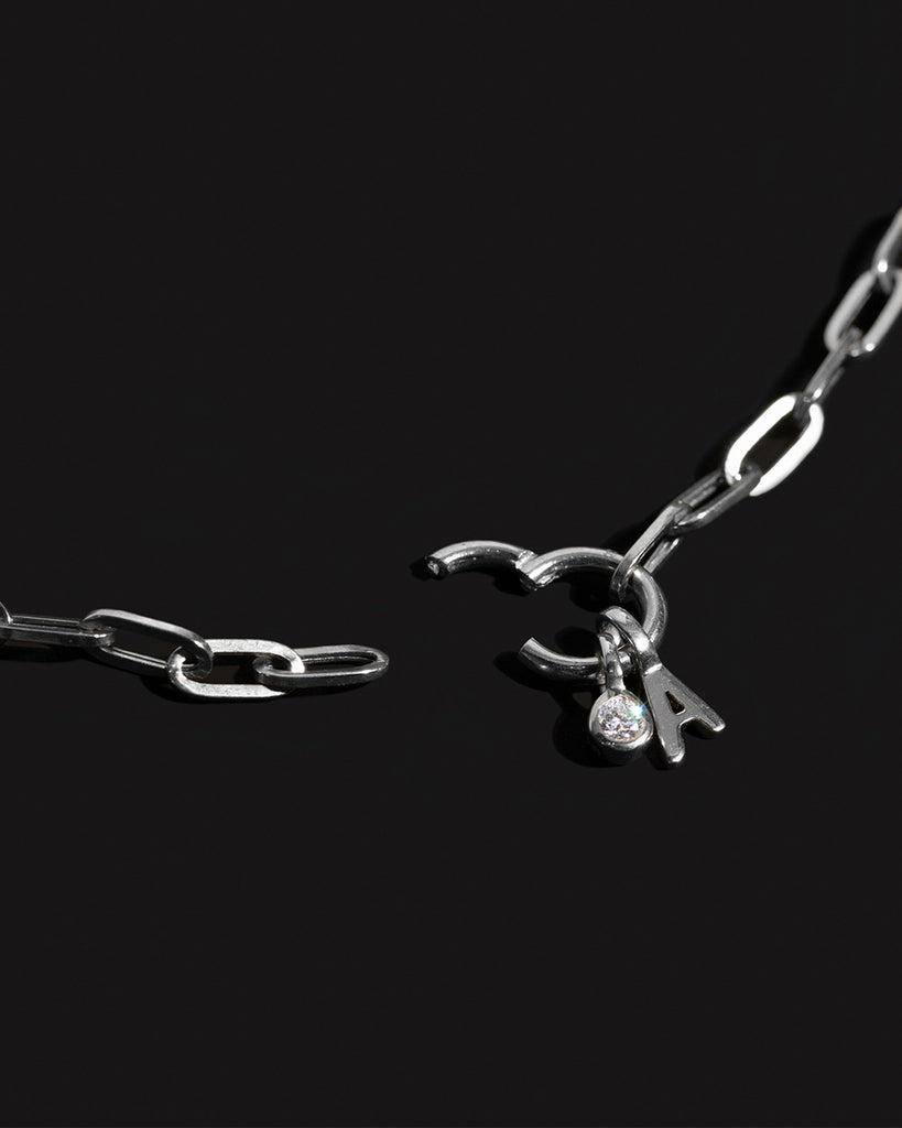 Recycled 925 sterling silver chain with initial charm and lab-grown diamond charm handmade in London by Maya Magal London