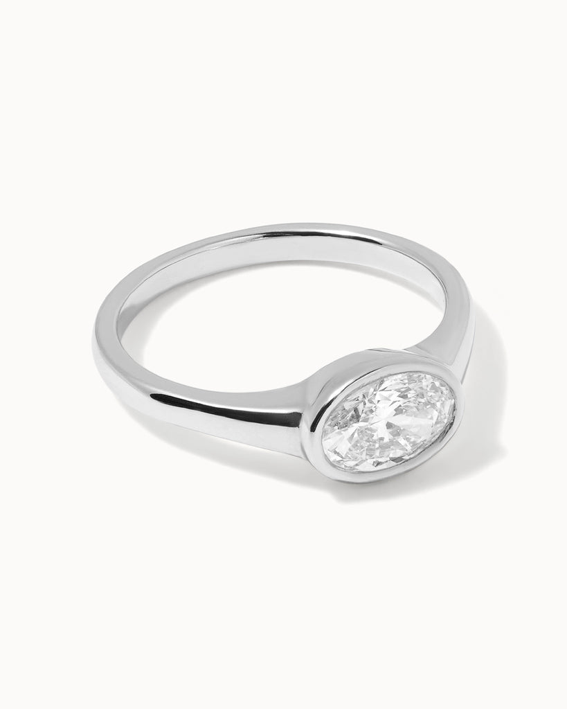 oval cut white diamond in a polished 9ct recycled white gold setting handcrafted in London by Maya Magal