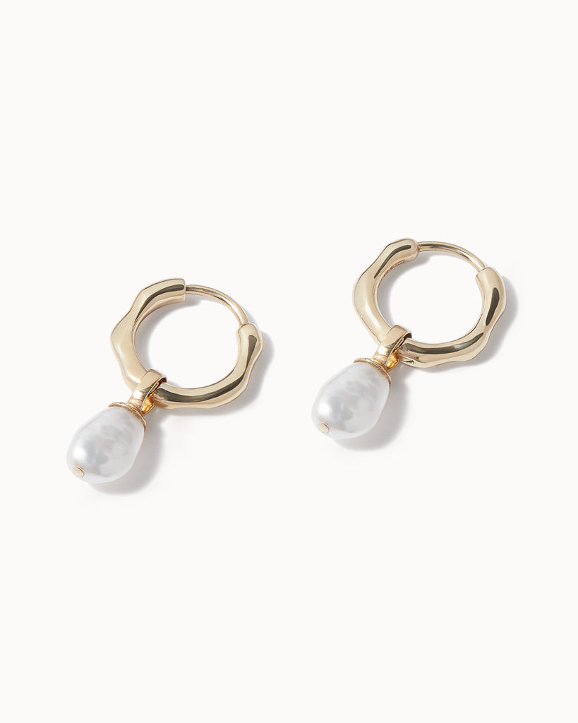 Maya Magal London handcrafted baroque pearl and solid gold organic huggie hoop earrings