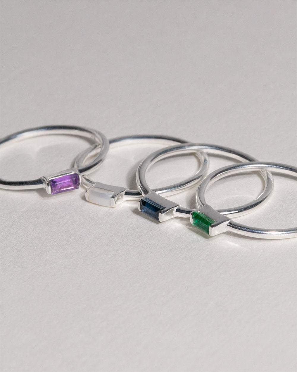 4 birthstone rings including June Pearl Birthstone Baguette Ring