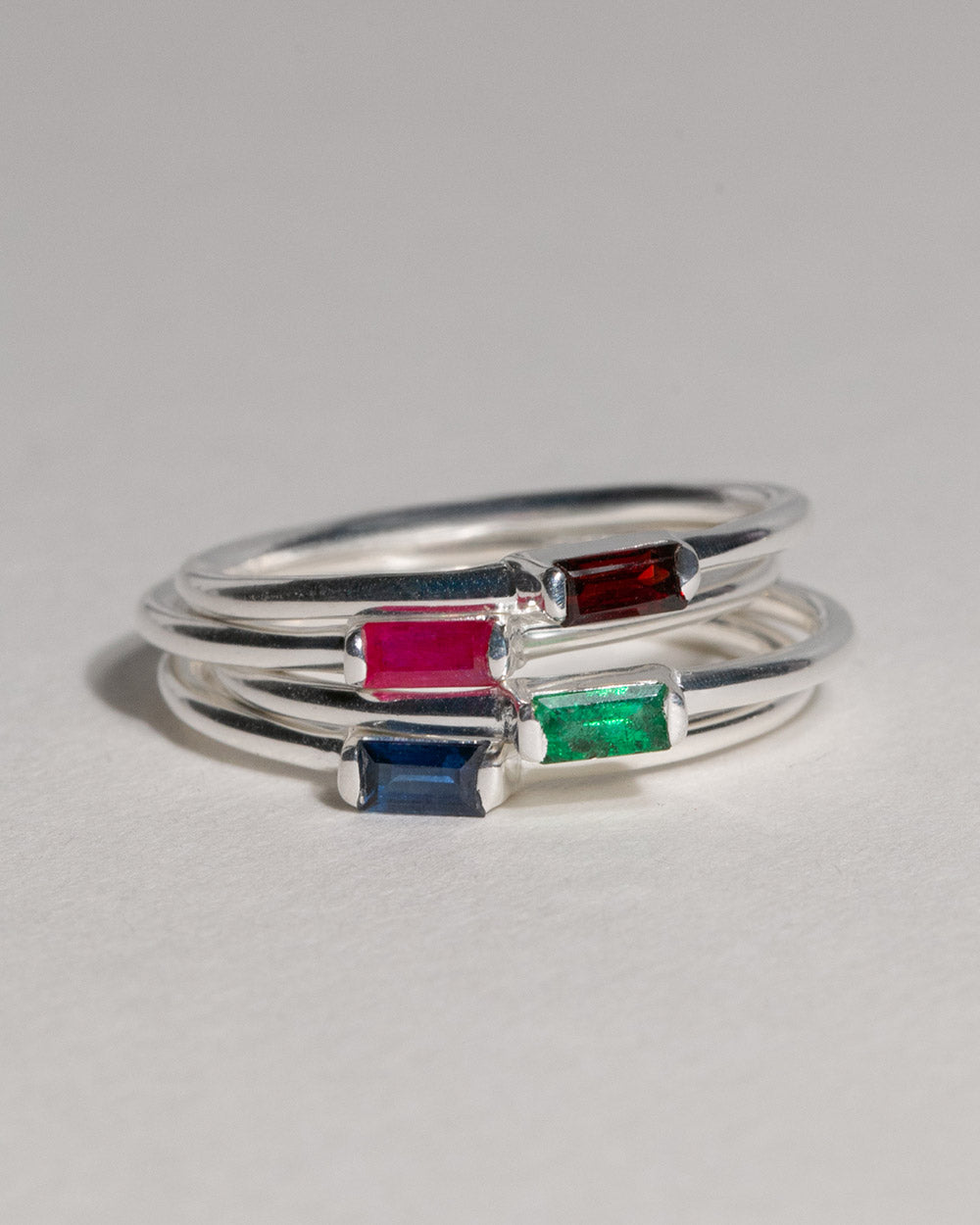 4 birthstone rings including July Ruby Birthstone Baguette Ring