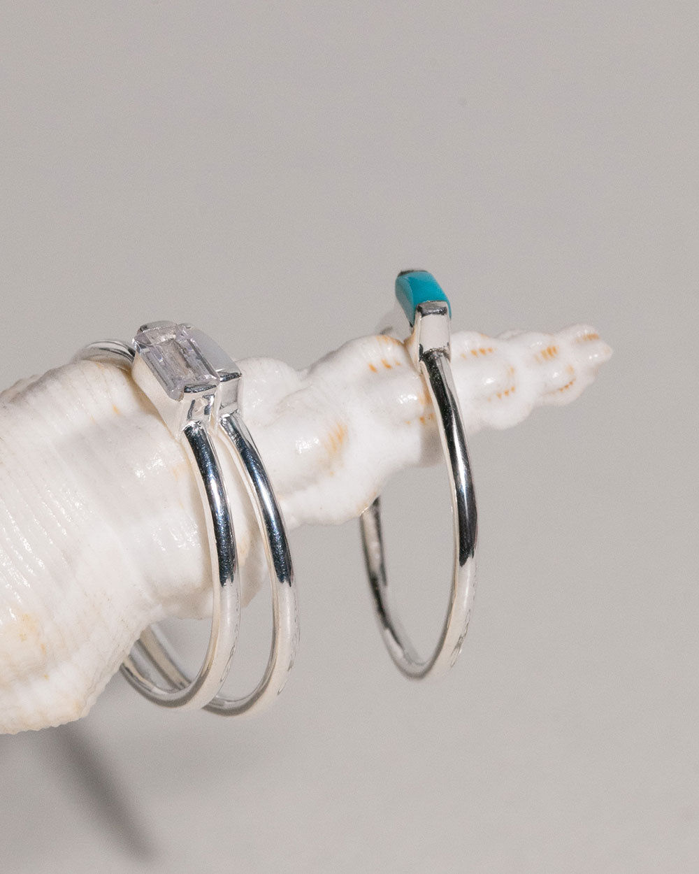 sterling silver April Crystal Birthstone Baguette Ring displayed on shell