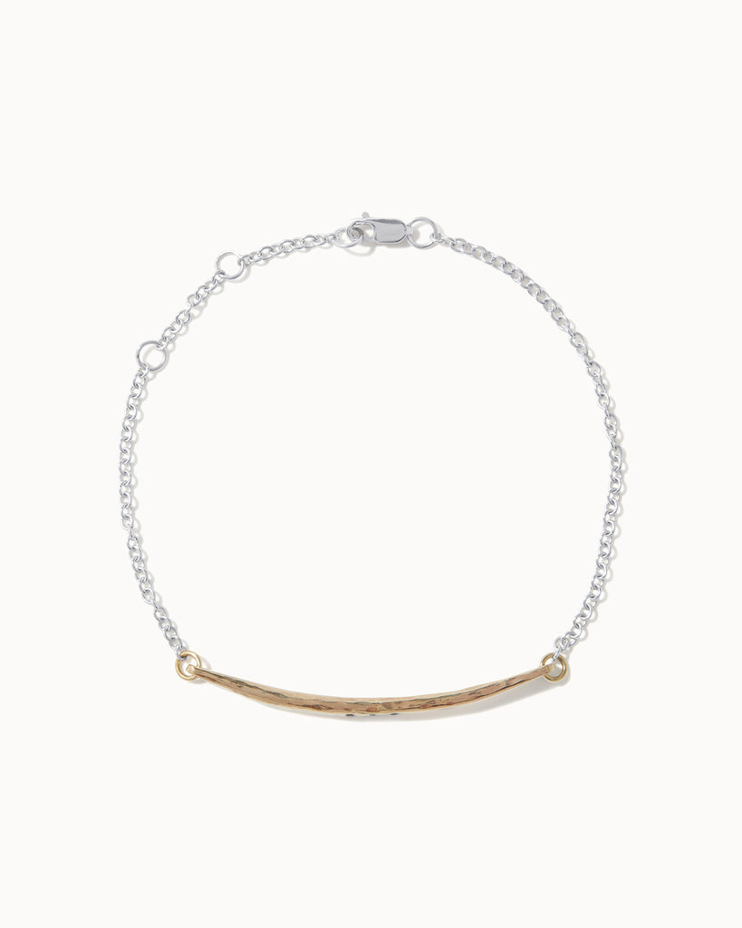 Recycled solid yellow and white gold chain bracelet featuring a hand carved bar with three black diamonds handcrafted in London by Maya Magal London