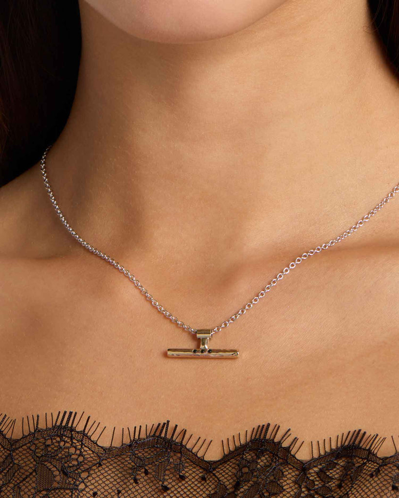 Recycled yellow and white gold T-Bar necklace featuring three black diamonds handcrafted in London by Maya Magal London