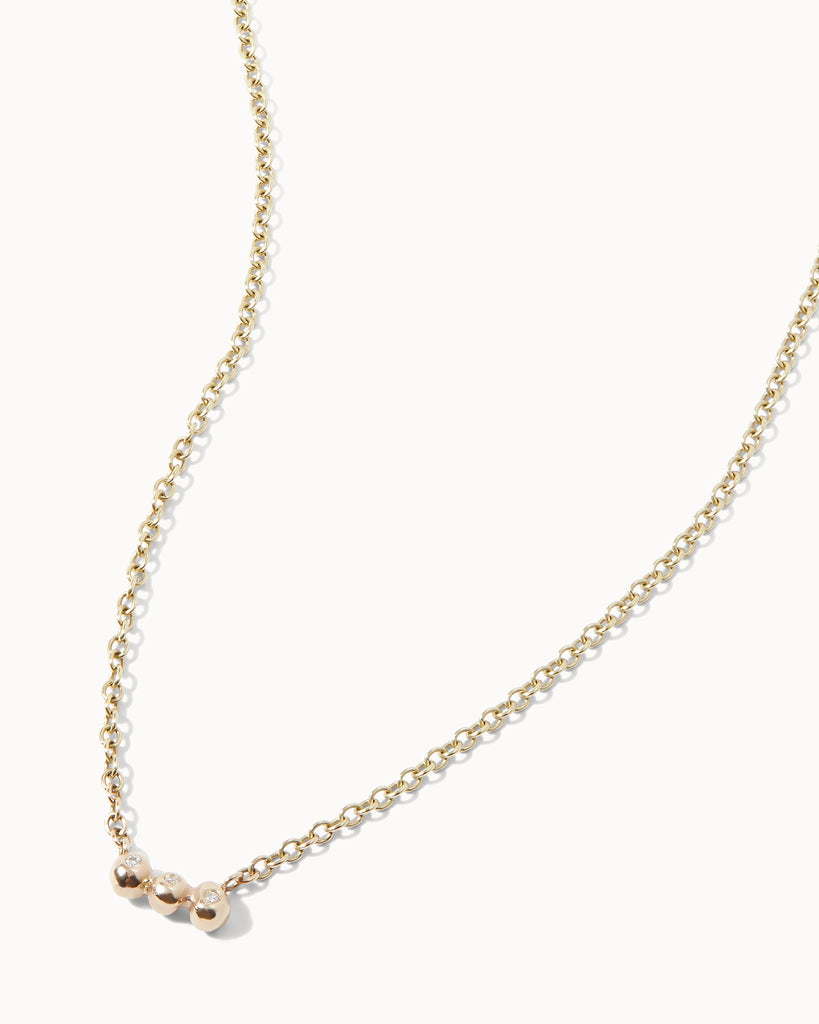 Recycled solid yellow gold chain necklace featuring three white diamonds in bezel setting handcrafted in London by Maya Magal London
