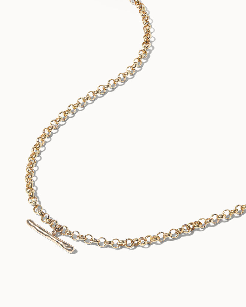A Belcher layering chain necklace with a handcrafted T-Bar made in London with recycled 9ct solid gold by Maya Magal Jewellery