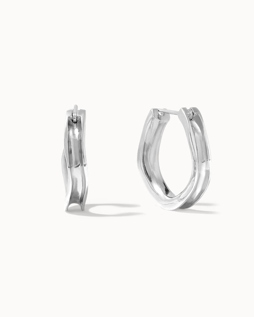 Recycled sterling silver concave hoop earrings handcrafted in London by Maya Magal London