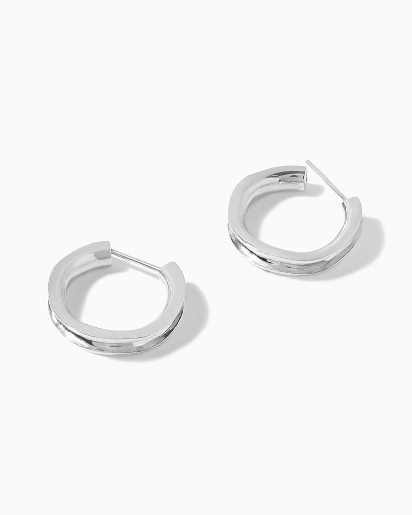 Recycled sterling silver concave hoop earrings handcrafted in London by Maya Magal London