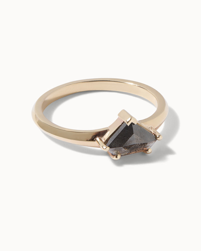 solid gold engagement ring featuring a shield cut grey diamond handcrafted in London by Maya Magal London