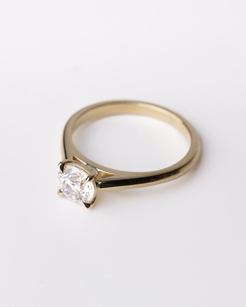 Solitaire engagement ring with brilliant cut lab grown diamond set on a recycled 9ct solid gold band handcrafted in London by Maya Magal London