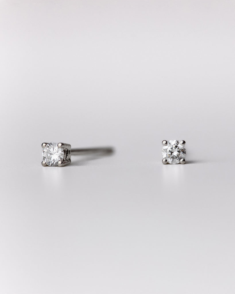 Round cut diamond stud earrings set in recycled 9ct solid white gold handcrafted in London by Maya Magal London