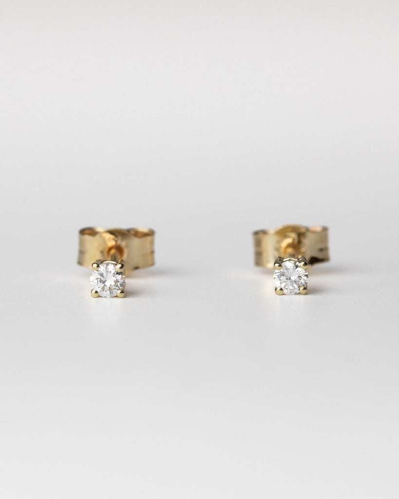 Round cut diamond stud earrings set in recycled 9ct solid yellow gold handcrafted in London by Maya Magal London