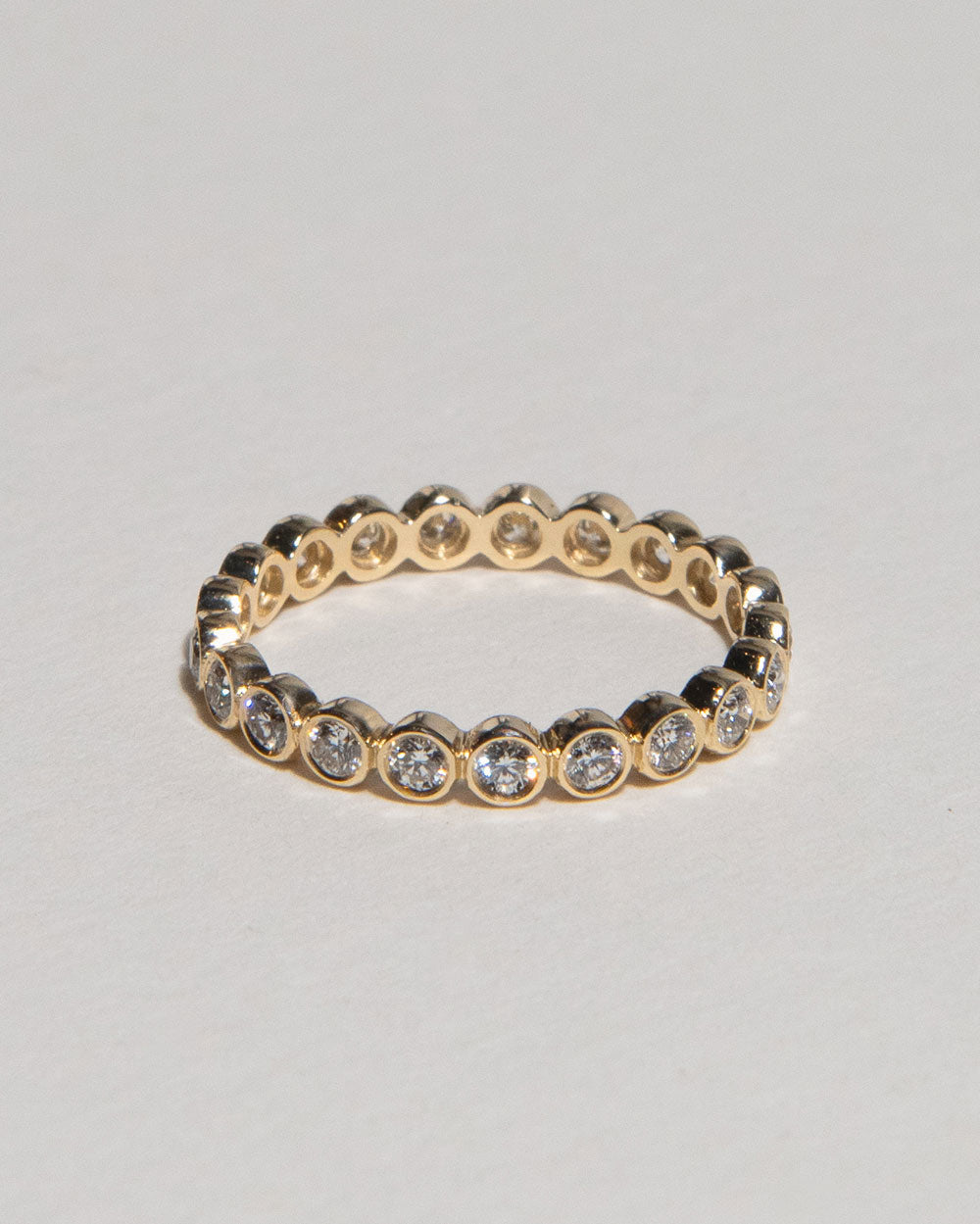 18ct Yellow Gold Bezel Diamond Eternity Ring on white background