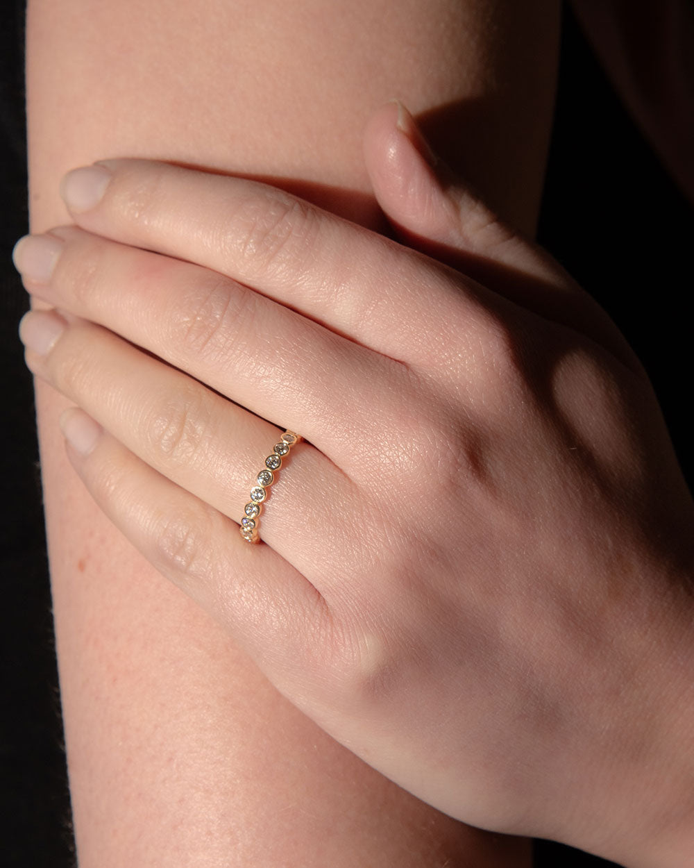 model wearing 18ct Yellow Gold Bezel Diamond Eternity Ring
